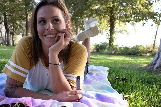 A person refilling a modern refillable vape device, symbolizing the new era in Australian vaping.